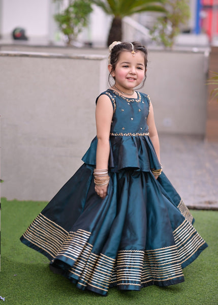 Seerat SHIREEN girls teal luxury raw silk peplum and lehenga set
Detailed hand-crafted Adda work on Seerat SHIREEN teal peplum
Breathtaking 10-yard flare on Seerat SHIREEN teal raw silk lehenga