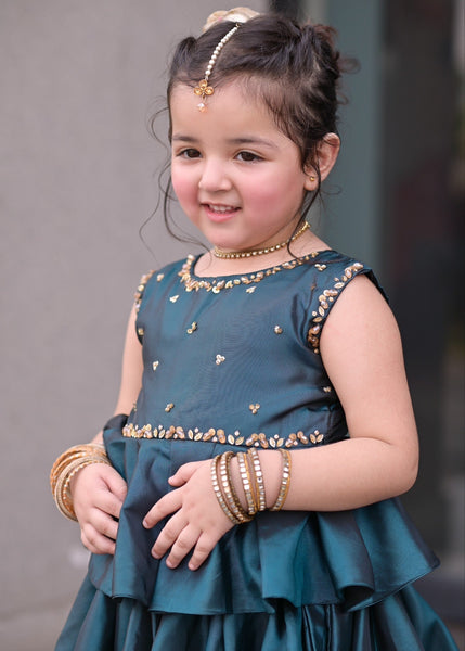 Seerat SHIREEN girls teal luxury raw silk peplum and lehenga set
Detailed hand-crafted Adda work on Seerat SHIREEN teal peplum
Breathtaking 10-yard flare on Seerat SHIREEN teal raw silk lehenga