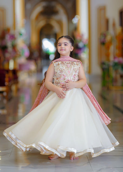 Seerat EZZA girls off-white tissue choli and silk lehenga set
Detailed hand-crafted Adda work on Seerat EZZA tissue choli
Full silhouette of Seerat EZZA multi-layered silk lehenga