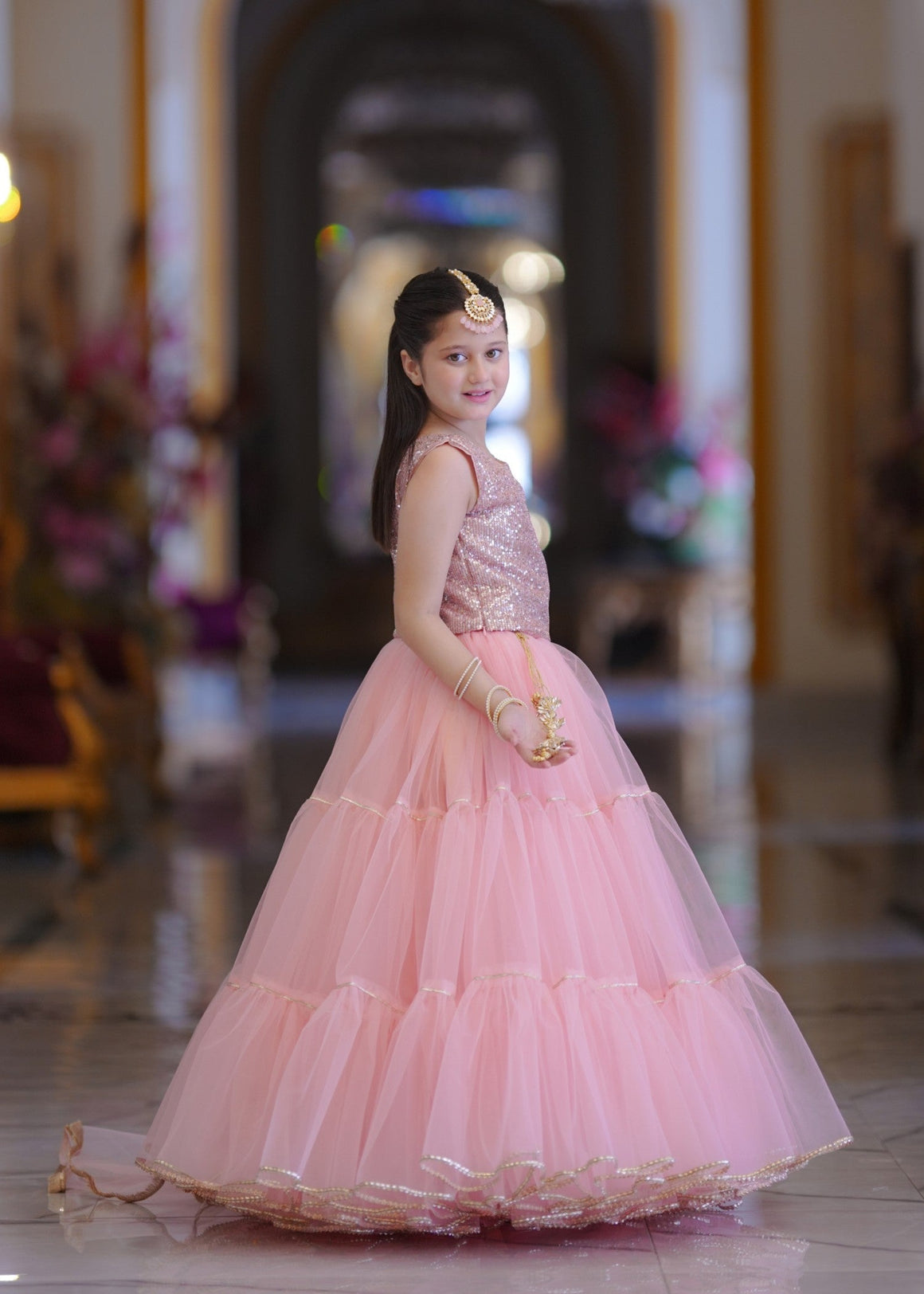 Seerat LAADLI girls dark green zari cotton lehenga choli - Full View
Detailed cut-work on Seerat LAADLI zari cotton choli
Voluminous multi-layered net lehenga in dark green by Seerat